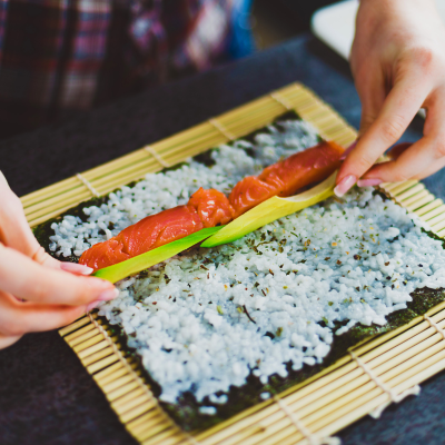 Salmon and avocado sushi making